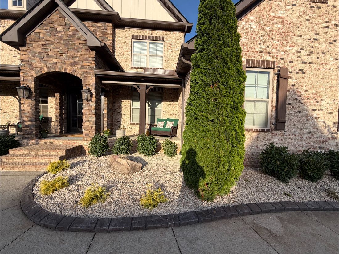 Decorative stone beds and shrubs